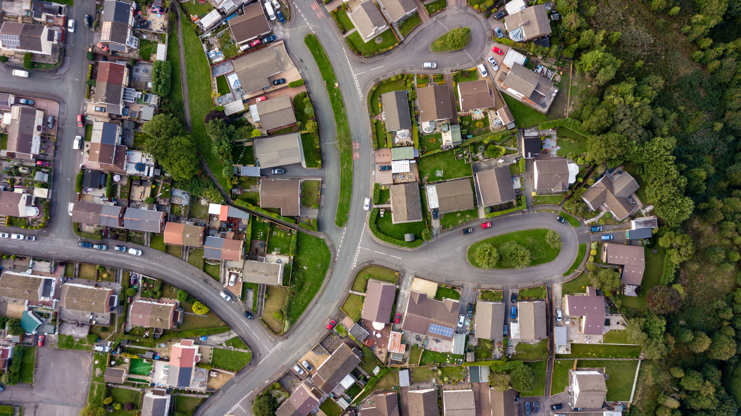 Top down aerial view of urban houses and streets in a residential area of a Welsh town
