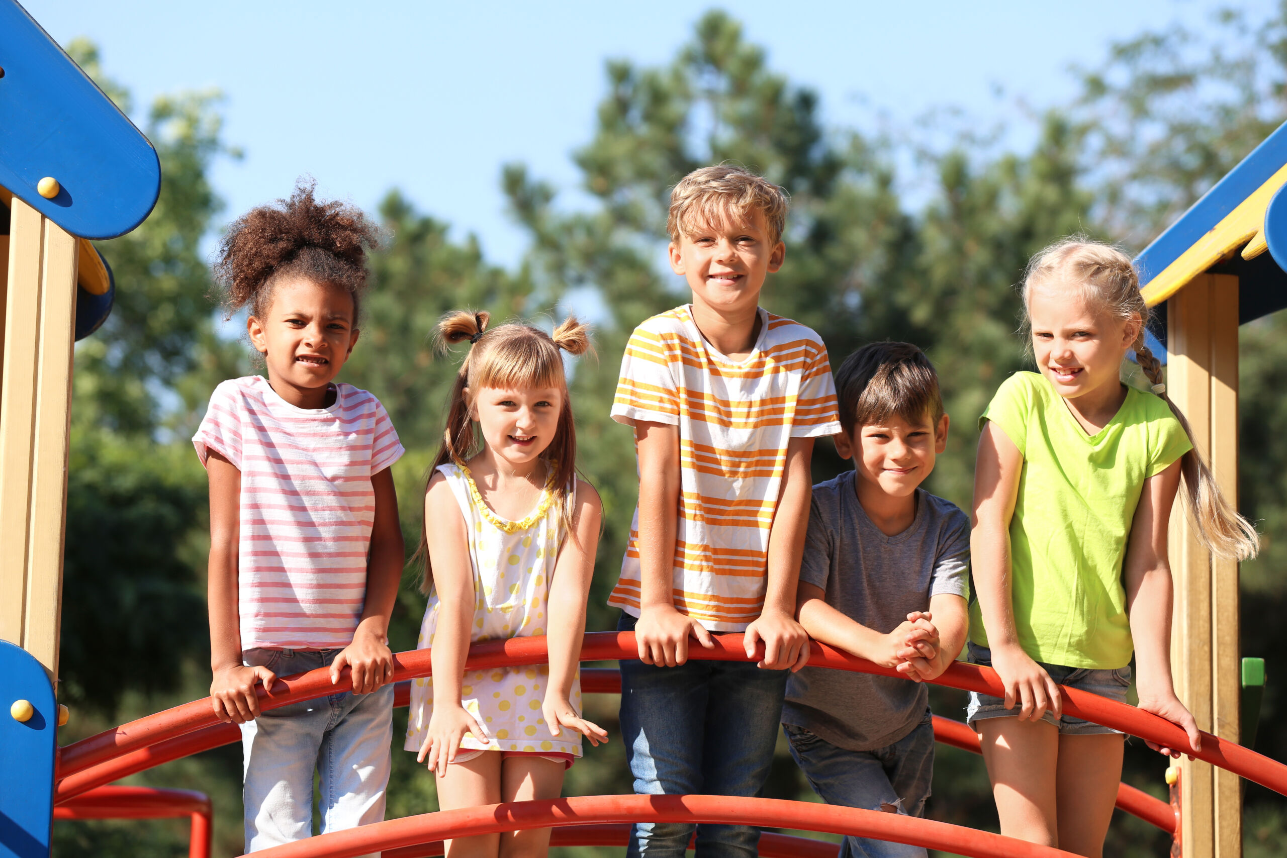 Cute little children having fun on playground outdoors